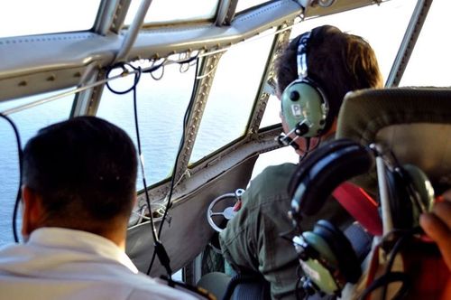 Argentine Air Force members during search operations for the missing Argentine submarine ARA San Juan, at sea off the coast of Argentina. (AAP)