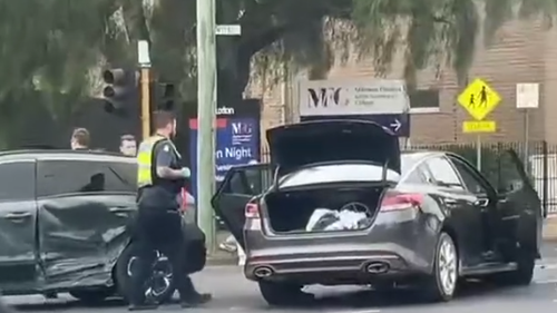 Police were seen taking at least one person from the scene.