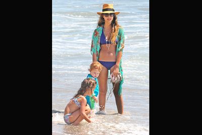 After giving birth to two kids, how does she do it? Jess looks taut and trim with kids Haven and Honor in Malibu.<br/><br/>Image: Splash