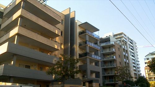 Police found a 22-year-old man at the unit in Warwick Farm around 4.45am with multiple gunshot wounds.