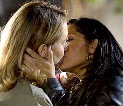 <B>The kiss:</B> During the season four finale, a slow build-up of chemistry and sexual tension between Callie (Sara Ramirez) and Erica (Brooke Smith) resulted in a sweet kiss.<br/><br/><B>Tacky or touching?</B> Suspiciously touching. While the path laid out to the kiss was long and romantic, <I>Grey's</I> creator Shonda Rhimes said the plot was created "to see what would happen if a woman suddenly had feelings for another woman" &#151; leaving us wondering whether the means were put in place to justify the ends.