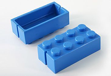 When did Lego begin producing interlocking plastic bricks?