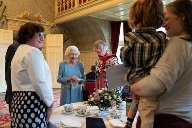 Queen Elizabeth attends a reception with representatives from local community groups to celebrate the start of the Platinum Jubilee, in the Ballroom of Sandringham House on February 5, 2022