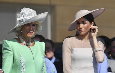 Meghan, the Duchess of Sussex, with Camilla, the Duchess of Cornwall, during a garden party at Buckingham Palace in London in 2018