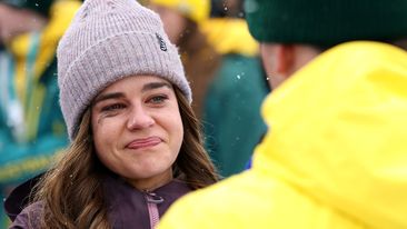 LIVIGNO, ITALY - FEBRUARY 12: Britteny Cox interacts with Cooper Woods of Team Australia after in Men's Freestyle Skiing Moguls Final 2 on day six of the Milano Cortina 2026 Winter Olympic games at Livigno Air Park on February 12, 2026 in Livigno, Italy. (Photo by Cameron Spencer/Getty Images)