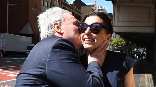 Michael Cranston embraces his wife Gloria after being found not guilty at the Downing Centre Courts in Sydney on Friday.