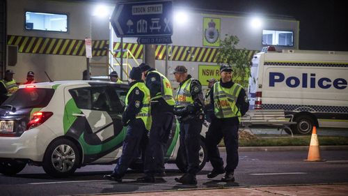 Police stop and question drivers at a checkpoint on July 8, 2020 in Albury, Australia. 