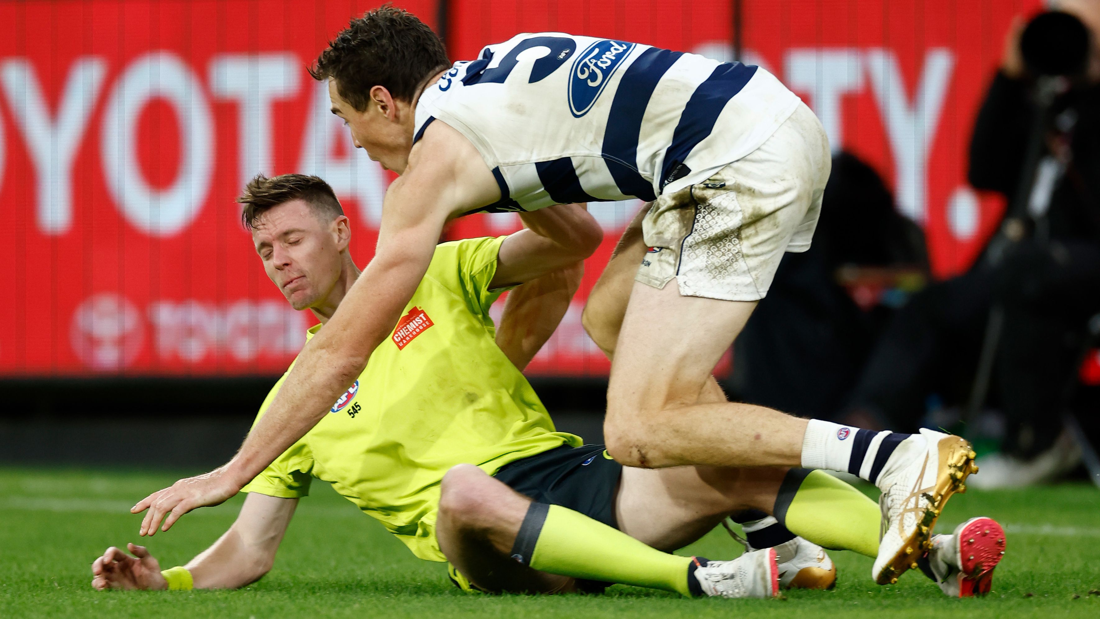 MELBOURNE, AUSTRALIA - APRIL 10: Jeremy Cameron of the Cats collides with the boundary umpire during the 2023 AFL Round 04 match between the Geelong Cats and the Hawthorn Hawks at the Melbourne Cricket Ground on April 10, 2023 in Melbourne, Australia. (Photo by Michael Willson/AFL Photos)