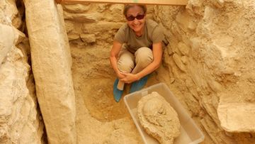 <p>Archaeologists have&nbsp;literally&nbsp;struck gold&nbsp;after an excavated&nbsp;site in southwest Greece&nbsp;they took to be&nbsp;an ancient house in fact&nbsp;proved to be the tomb of a Bronze Age warrior.</p><p>An international group of researchers, led by archaeologists from the University of Cincinnati stumbled upon a treasure-lined tomb while excavating an unexplored field&nbsp;in Pylos, on the&nbsp;southwest coast of Greece.</p><p>The tomb belongs to an adult male buried about 3500 years ago, dubbed&nbsp;the ‘griffin warrior’ for an ivory griffon plaque found resting between his legs.</p><p>More than 1400 artefacts including a&nbsp;gold-and-ivory hilted&nbsp;sword, gold necklaces, rings and precious stone beads have been recovered from the site – one of the biggest hauls&nbsp;at any single burial site in Greece ever.</p><p>The find has been hailed by&nbsp;a university representative as&nbsp;“one of the most magnificent displays of prehistoric wealth discovered in mainland Greece” in more than six decades.</p><p>Here, senior research associate Sharon Stocker  poses with a 3500 year-old skull found in the ancient tomb. </p><p><strong>Click through the gallery to see video and images of the surprise treasures.</strong></p><p>(University of Cincinnati)</p>