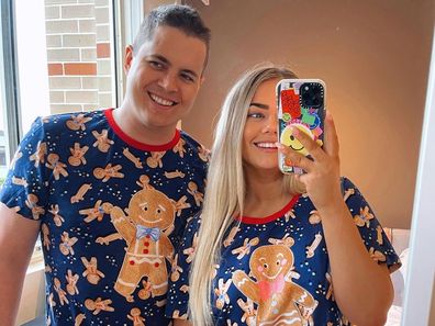 Johnny Ruffo and Tahnee Sims in Christmas PJs.