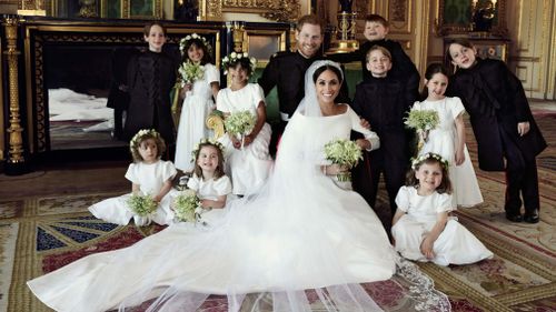 This photograph includes the couple and their bridesmaids and page boys. (Alexi Lubomirski)