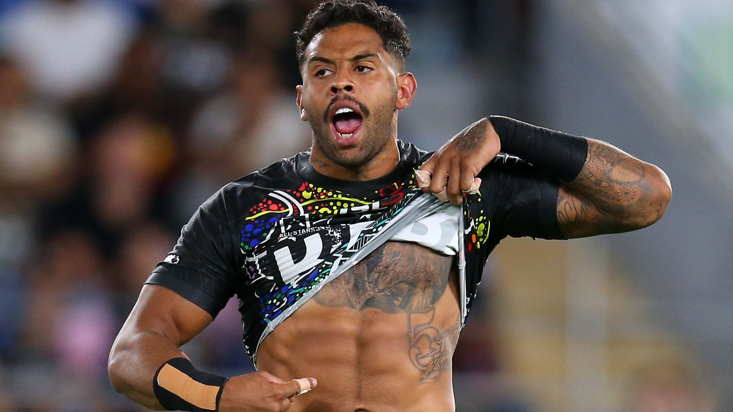 Josh Addo-Carr of the Indigenous All-Stars points to his skin before the 2020 game.