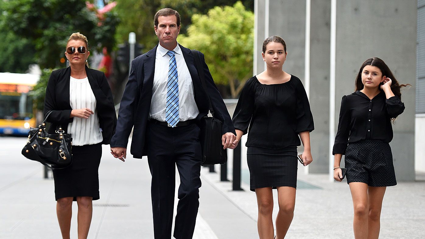 Former Billabong boss Matthew Perrin (2nd left) and his partner Belinda Otton (left), arrive for his trial at the District Court in Brisbane, (AAP)
