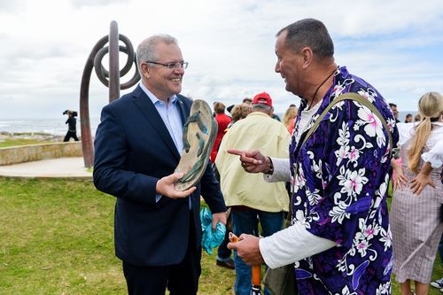 Prime Minister Scott Morrison chats to Bali bombing survivor Dave Byron are seen following the 16th anniversary commemorations at Coogee Beach, Sydney.