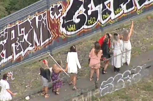 Some frustrated racegoers hopped off the stranded train. (9NEWS)