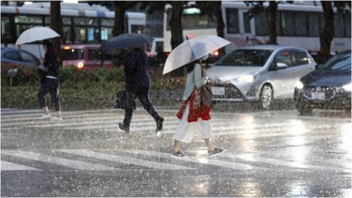 More than 200,000 people have been evacuated on an island in Japan's south as life-threatening levels of record rainfall hits. (Fukuoka)