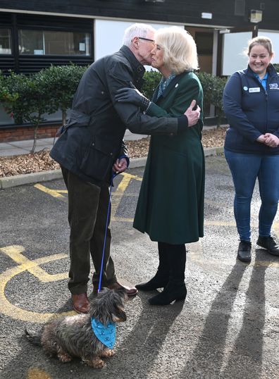 Camilla, Duchess of Cornwall, patron of Battersea Dogs and Cats Home, is greeted by Battersea Ambassador Paul OGrady, during her visit to Battersea Brand Hatch Centre on February 2, 2022 in Ash, England 