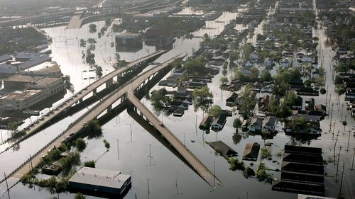 FILE - In this Aug. 30, 2005 file photo, Floodwaters from Hurricane Katrina fill the streets near downtown New Orleans. Hurricane Ida looks an awful lot like Hurricane Katrina, bearing down on the same part of Louisiana on the same calendar date. But hurricane experts say there are differences in the two storms 16 years apart that may prove key and may make Ida nastier in some ways but less dangerous in others.(AP Photo/David J. Phillip, File)