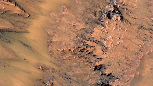 Marks left in gullies on Mars show evidence of flowing water. (NASA)