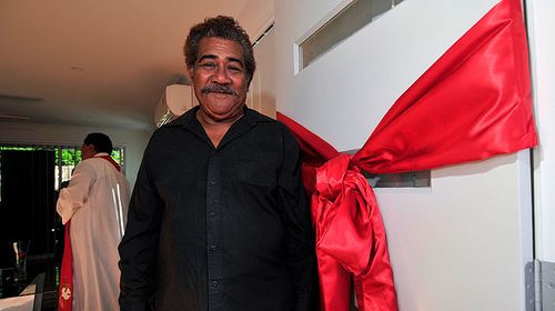 Tau Tafua stands at the door of his newly built home. (AAP)