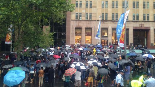 About 200 people attended a rally in Sydney's Martin Place in support of the Charlie Hebdo massacre victims. (9NEWS)