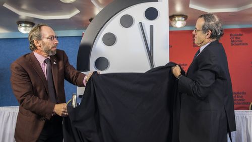 Lawrence Krauss (L), Director of the Arizona State University Origins Project, and Robert Rosner (R), University of Chicago professor unveiled the clock in Washington yesterday. (AAP)