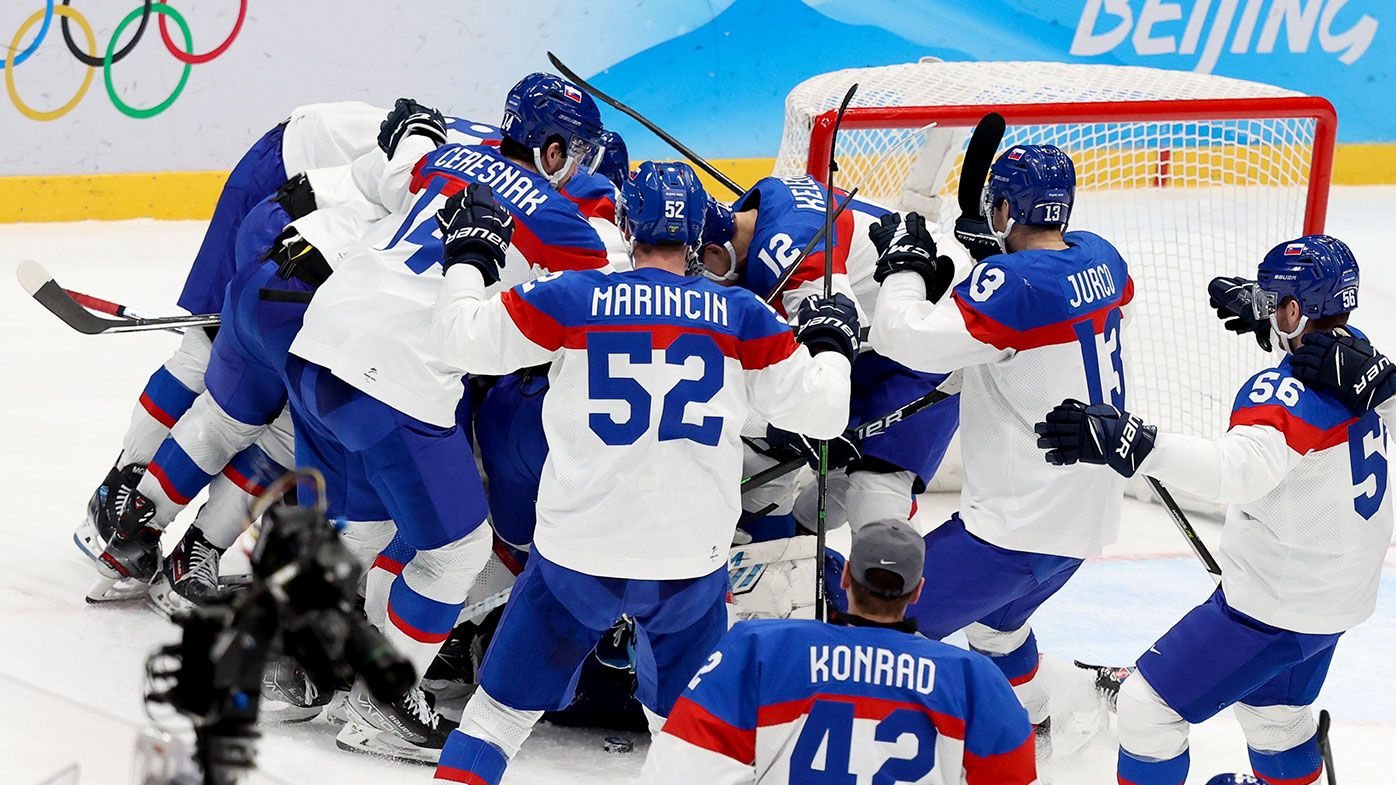 Players of Slovakia celebrate the victory after winning the penalty shootout 