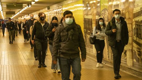 Commuters leaving Central station wearing masks in Sydney 