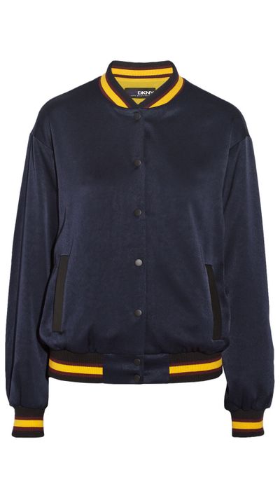 <a href="http://www.net-a-porter.com/product/506179/DKNY/-cara-delevingne-crepe-de-chine-varsity-jacket">Crepe De Chine Varsity Jacket, $372.31, DKNY</a>