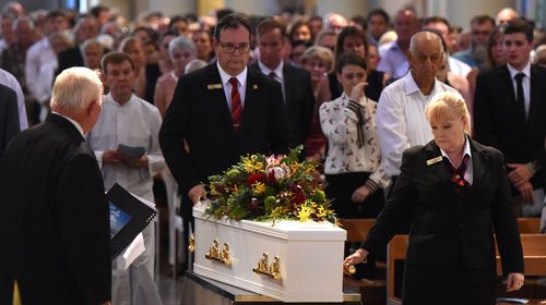 Family and friends farewell Cole Miller at his funeral.