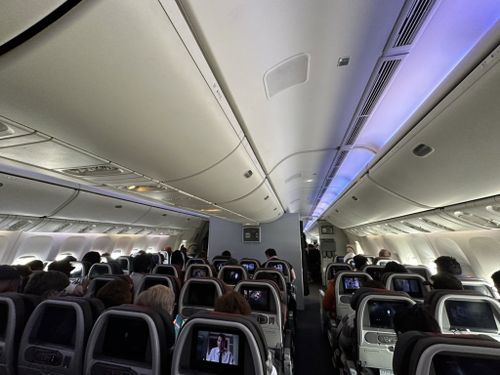 Passengers on Americans Airlines Flight 51 sat aboard their plane at London's Heathrow Airport for almost three hours, a passenger told CNN, because of delays resulting from the FAA outage.