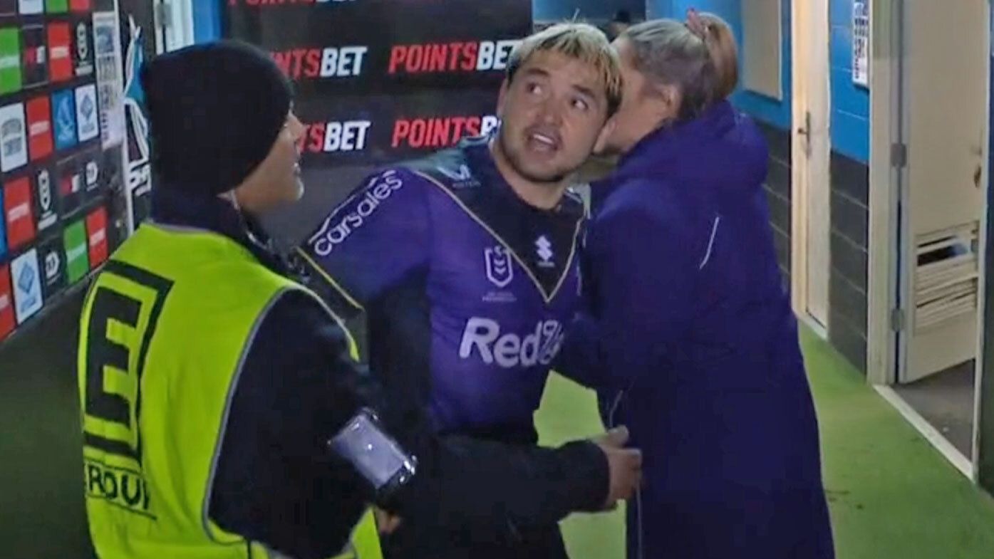 Storm star Brandon Smith argues with a Sharks fan after being sin binned.