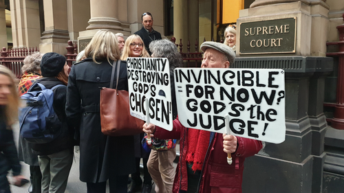 Protesters gathered ahead of Cardinal Pell's arrival this morning.