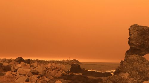 An orange hazy sky is seen over Narooma in NSW, Saturday, January 4, 2020