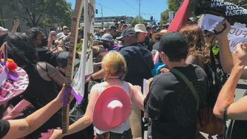 Victoria Police said they were &quot;confronted&quot; by &quot;up to 50&quot; protesters soon after the march started.﻿