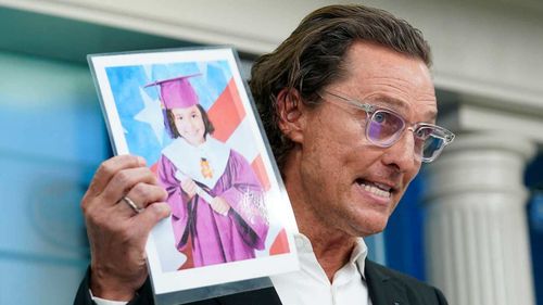 Matthew McConaughey holds an image of Alithia Ramirez, 10, who was killed in the mass shooting at an elementary school in Uvalde, Texas.