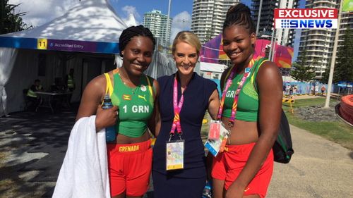 9NEWS reporter Christine Ahern with the Grenada women's beach volleyball team. (9NEWS)