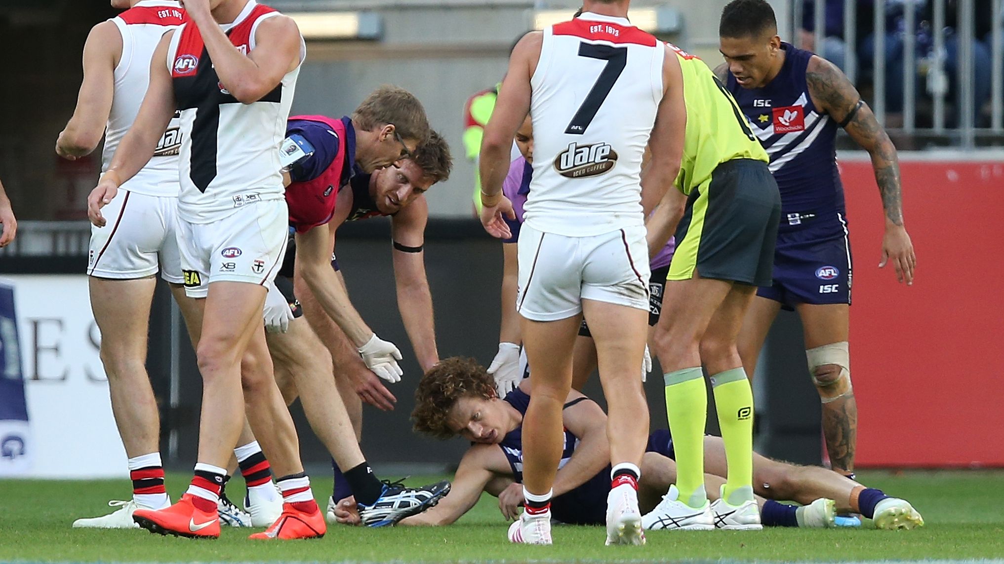 Nathan Fyfe of the Dockers is attended to by medical staff after being concussed in 2019 in Perth. (Photo by Paul Kane/Getty Images)