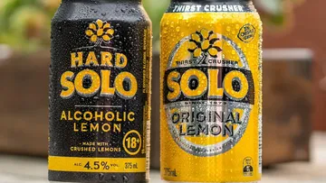 A can of Hard Solo next to a can of the soft drink Solo.