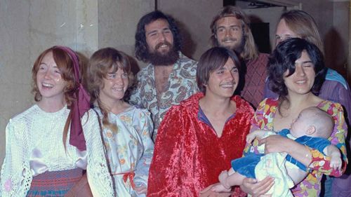 Members of the Manson family grin for the cameras outside court. Lynette "Squeaky" Fromme, on the far left, would later try and assassinate President Gerald Ford.