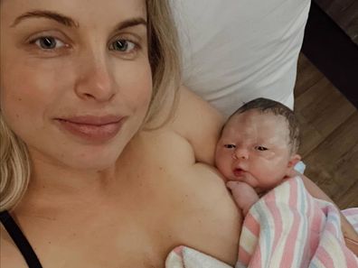 Keira Rumble holds her daughter Goldie, born May 2023.