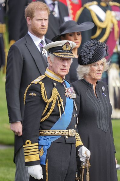 King Charles III, Camilla, the Queen Consort, Meghan, Duchess of Sussex, and Prince Harry watch as the coffin of Queen Elizabeth II is placed into the hearse following the state funeral service in Westminster Abbey in central London Monday Sept. 19, 2022. 