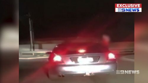 Another clip, also filmed in Paralowie, showed youths flailing their arms out of the window. (9NEWS)