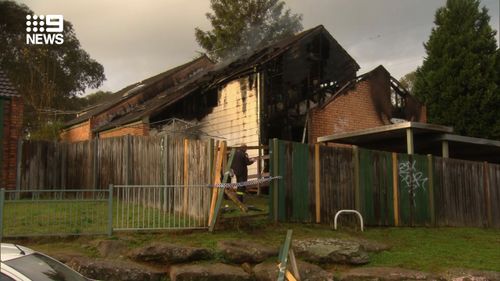 A body has been found following a suspicious house fire in Sydney's Macquarie Fields this morning.