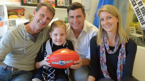 AFL players and media personalities unite to give cancer the boot