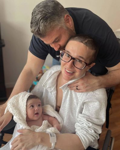 Jackie Miller James with her baby and husband after suffering an aneurysm rupture at nine months pregnant.