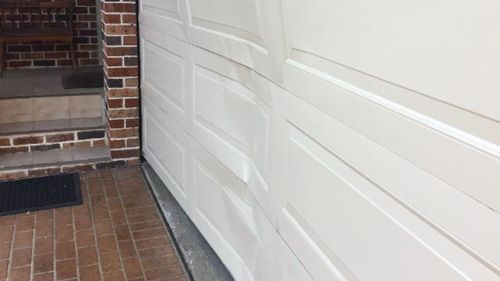 The door was damaged by the impact.
