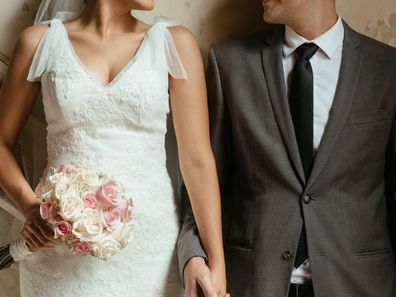 Newlywed couple in wedding outfits