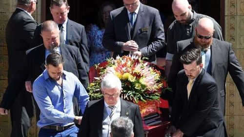 David Turner (front left), partner of Dreamworld accident victim Kate Goodchild carries her coffin out of St Christopher's Cathedral in Canberra on Monday. (AAP)