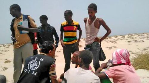 IOM staff assist Somali, Ethiopian migrants who were forced into the sea by smugglers (UN Migration Agency - IOM).